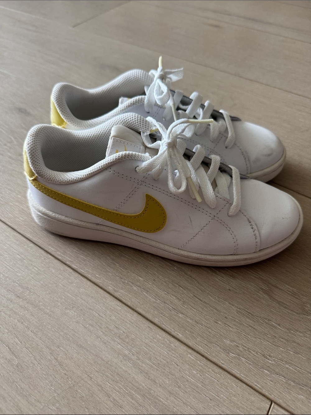 Nike White Sneakers with Yellow Swoosh